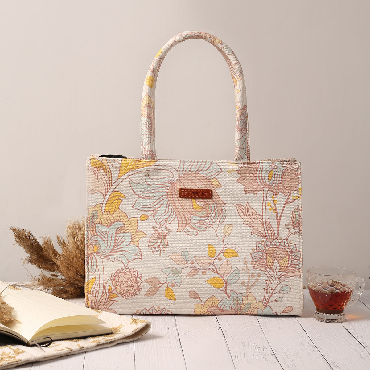White and yellow floral print tote bag, perfect for spring outings.