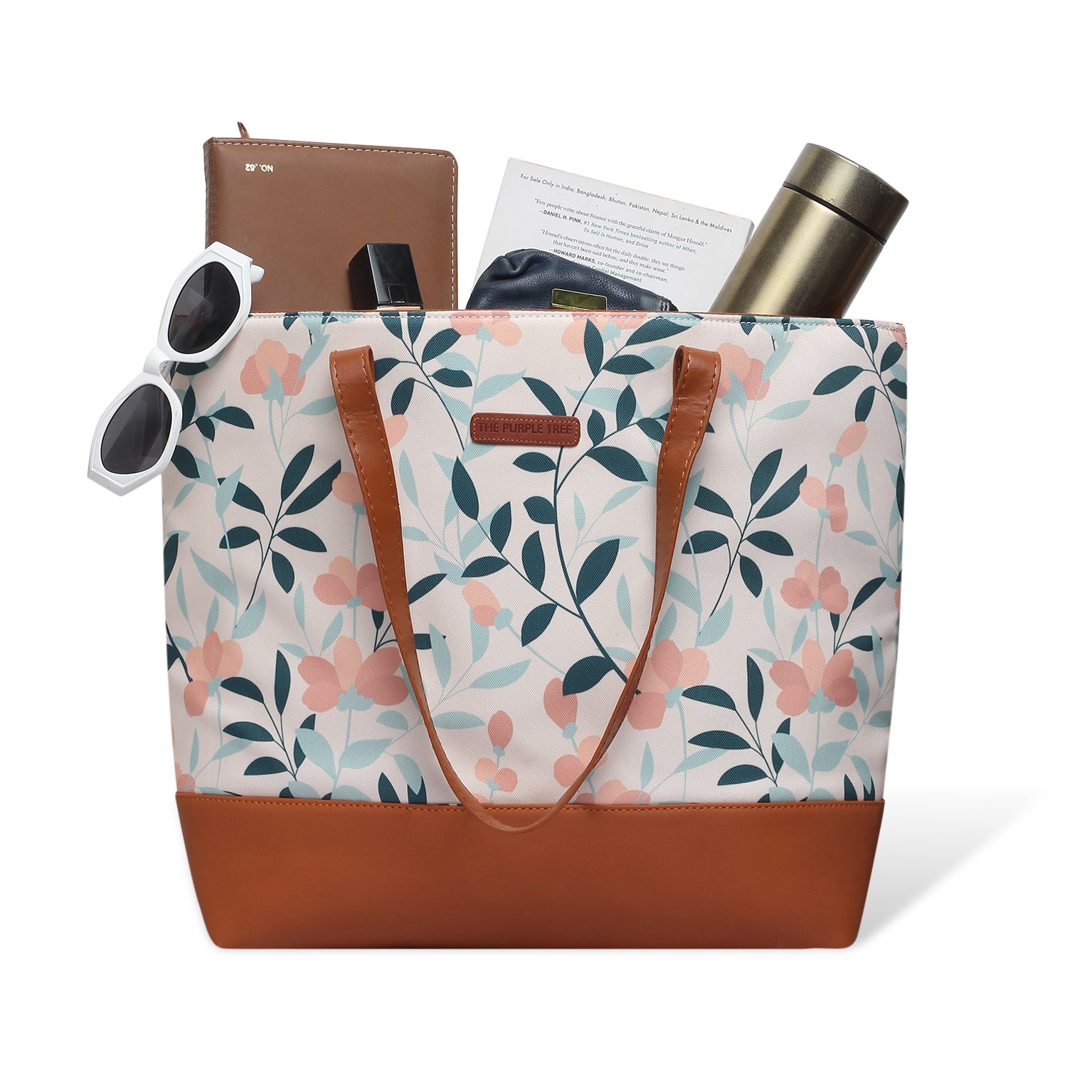 Chic tote bag featuring floral pattern and leather handle
