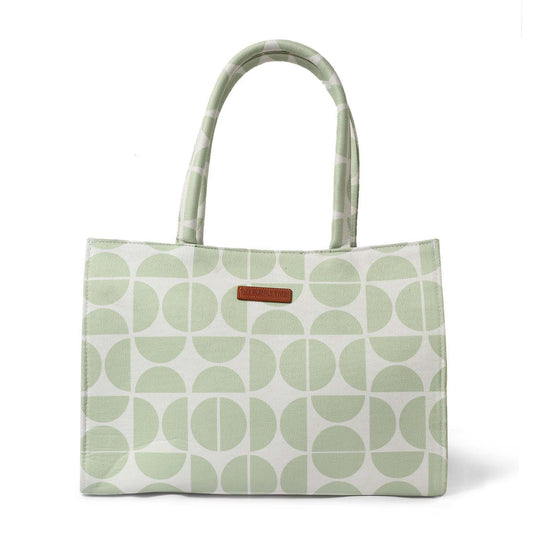 Tote bag in green and white with book and notebook inside.