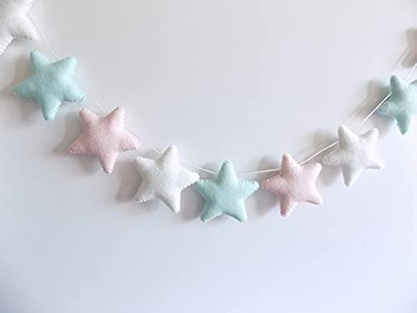 Add a cozy and magical touch to your decor with this felt star garland.