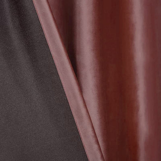 curtain hanging next to a white vase.