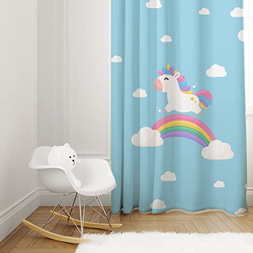 Majestic unicorn in sky above blue curtain.