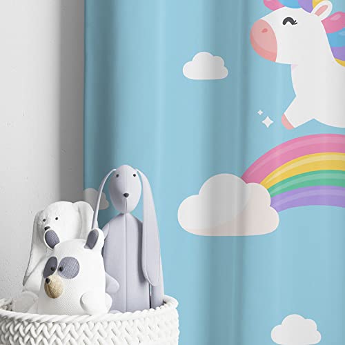 Blue curtain backdrop with unicorn in flight.