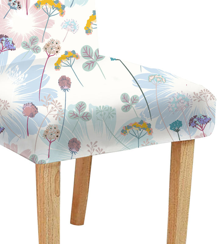 Elegant chair with floral design and a vase, creating a charming atmosphere in the room.