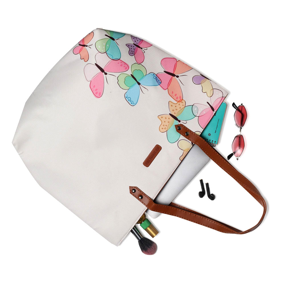 Colorful butterflies adorn this roomy tote bag, adding a touch of whimsy to your look.