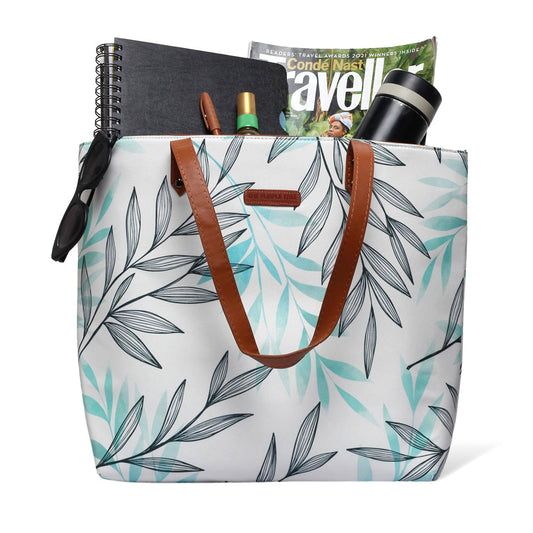 White and green leaf print tote bag, perfect for carrying essentials in style.
