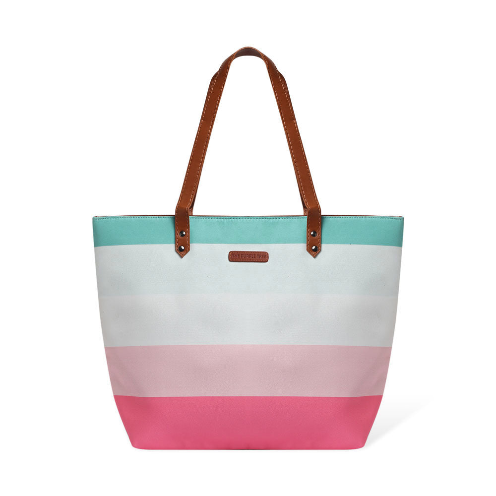 Chic tote bag featuring pink, blue, and white stripes, ideal for adding a pop of color to your outfit.