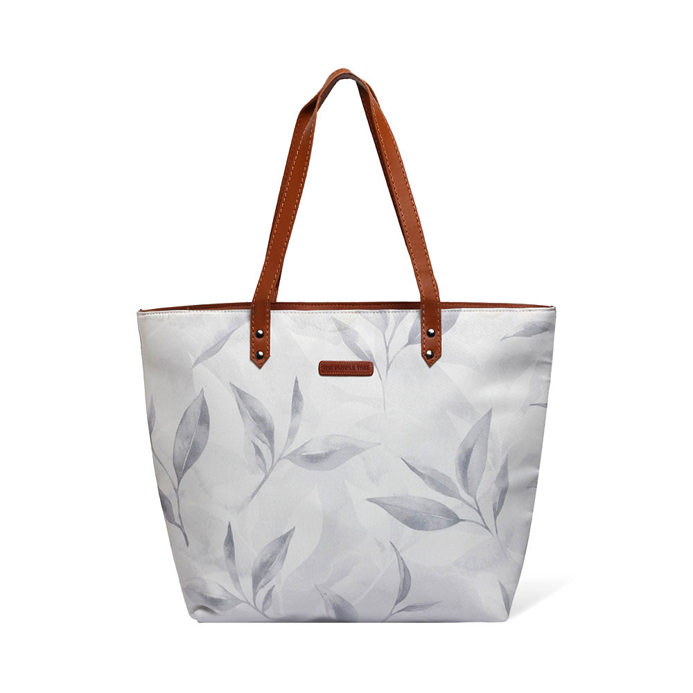 A stylish tote bag with a white and gray leaf print design. Perfect for carrying your essentials in style.