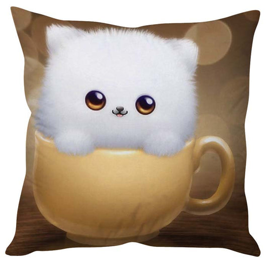 Adorable white cat relaxing in cup on fluffy pillow, looking serene.