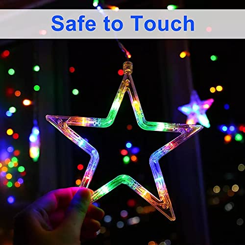A cozy room with a curtain adorned with hanging stars.