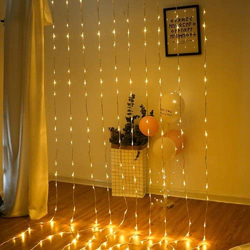 Room featuring a curtain made of twinkling string lights for a magical ambiance.
