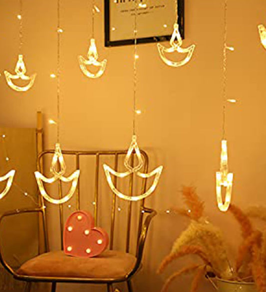 Interior of a pink room featuring a chair and a lamp.