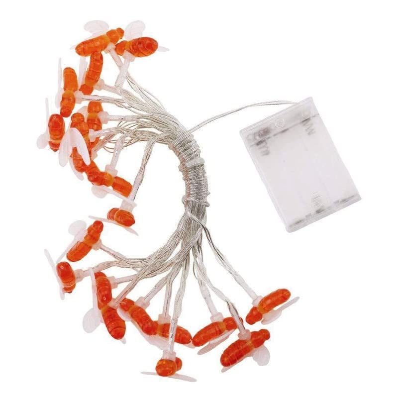 Festive orange lights on white cord