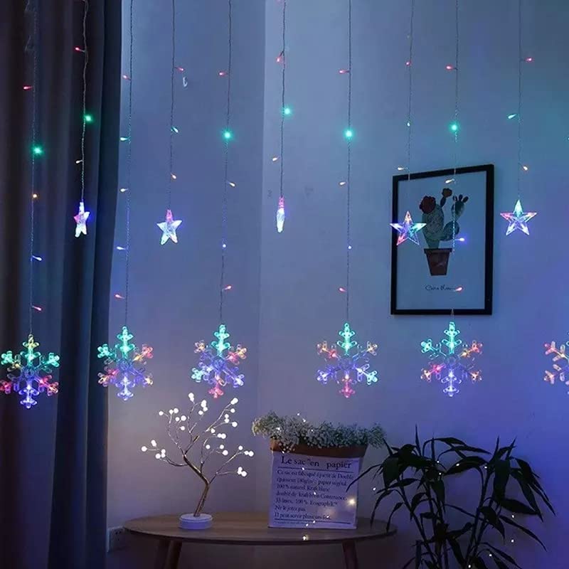 A cozy room with a beautiful snowflake hanging from the ceiling, illuminating the space with a warm glow.