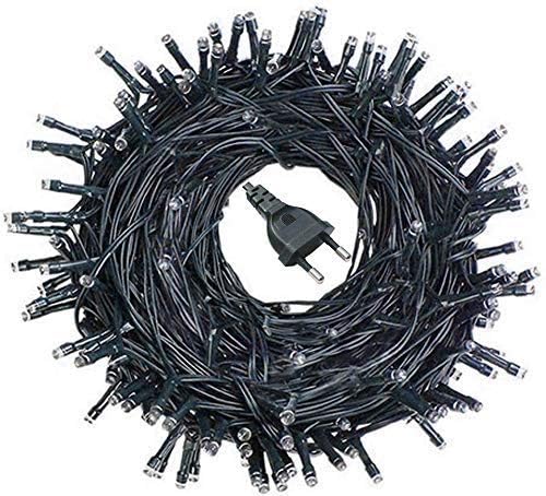 A variety of colorful Christmas lights glowing brightly in the dark.