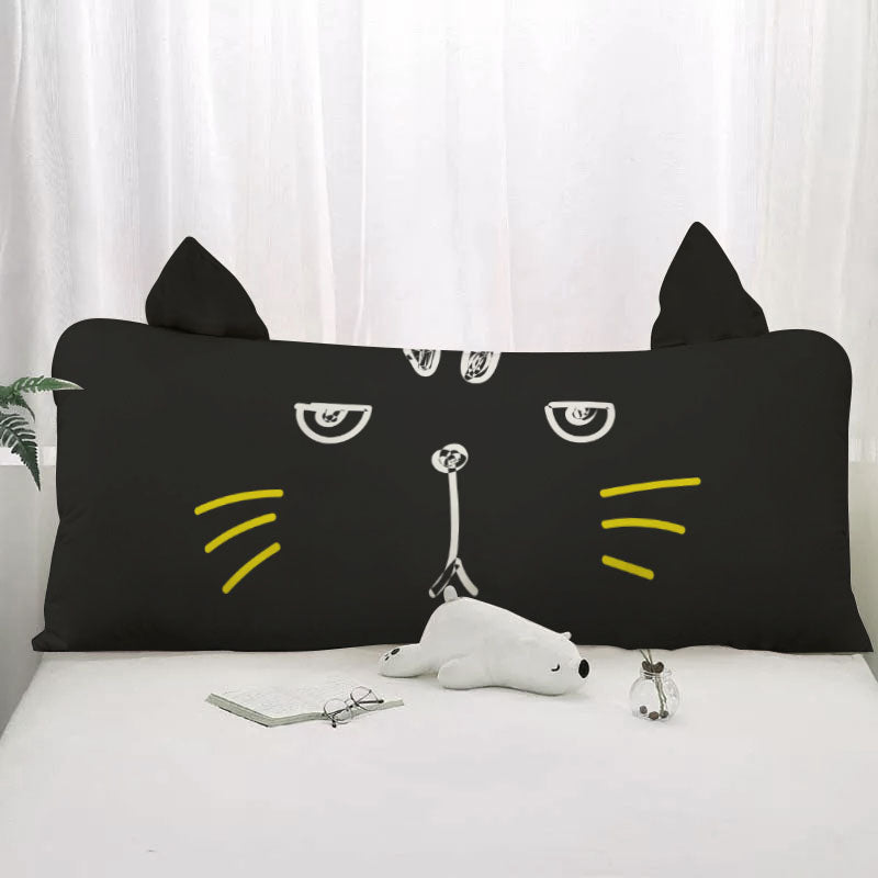 Black cat pillow with bright yellow eyes, perfect for cat lovers.