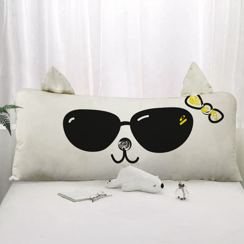 Cat with cool shades relaxing on a pillow.