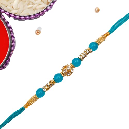 Celebrate Raksha Bandhan with a stunning blue and gold rakhi with crystal bead.