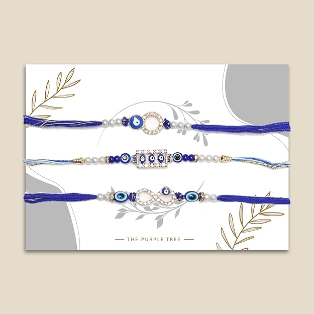 Trio of blue rakhi adorned with gold and blue beads, ideal for Raksha Bandhan festivities.
