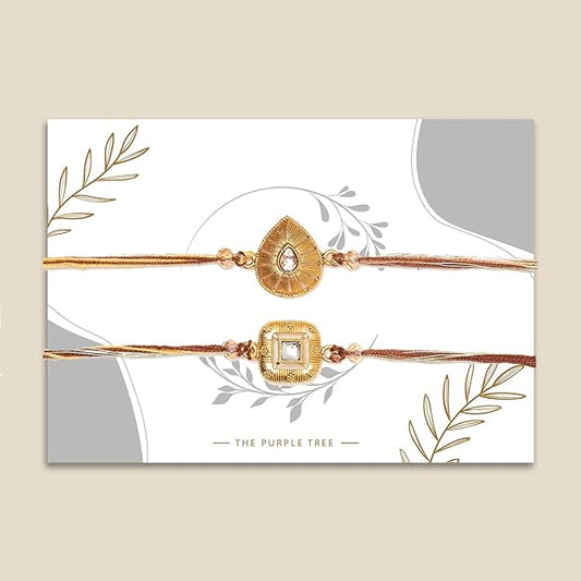 Beautiful gold rakhi with heart and diamond accents.