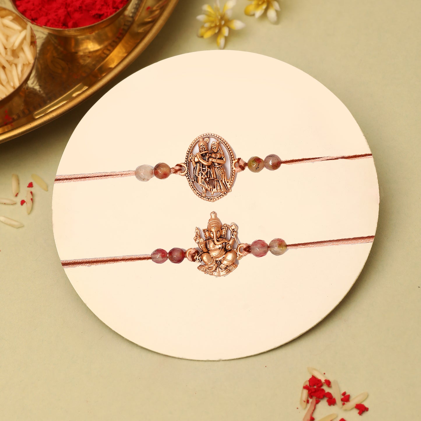 Rose Gold Divine Ganesha and Radha Krishna Rakhi