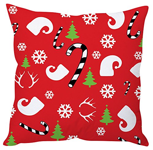 A red pillow featuring black and white snowmen, candy canes, and reindeer in a festive design.
