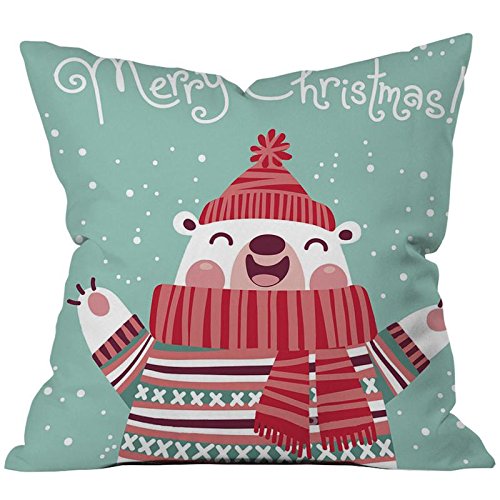 A charming pillow showcasing a cute polar bear in a red scarf and hat, adding a playful touch to any room.