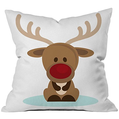 A decorative cushion adorned with a delightful reindeer, ideal for holiday decor or a cozy living room.