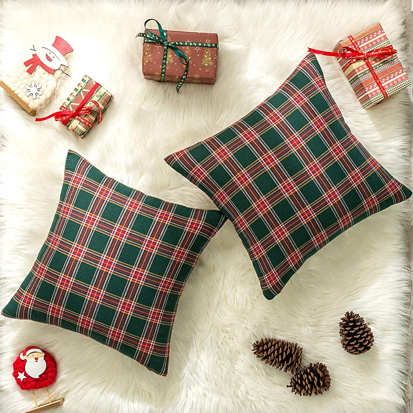 A duo of pillows showcasing vibrant plaid patterns, perfect for adding flair to your seating area.
