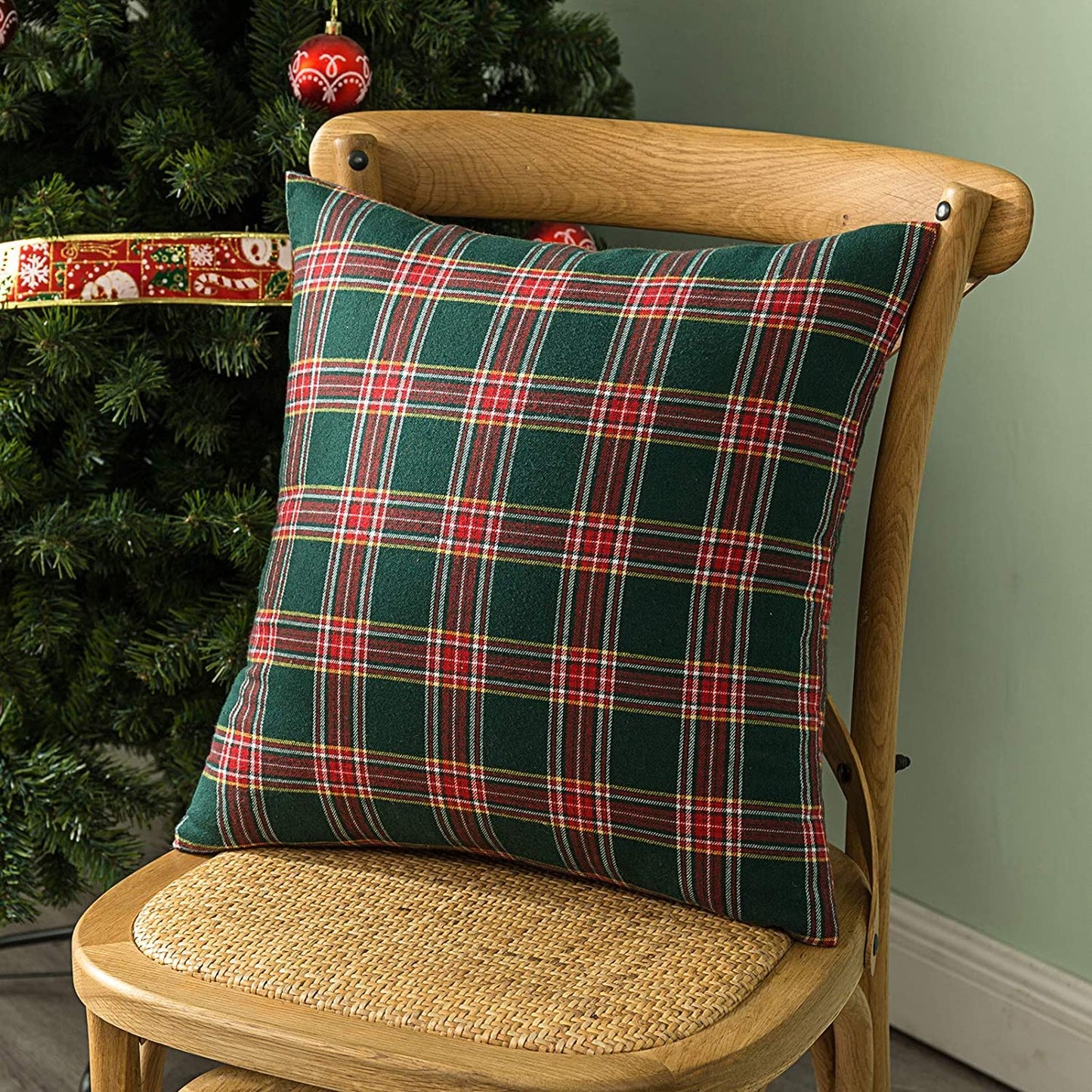 Two soft pillows adorned with classic plaid designs, bringing a cozy vibe to your home decor.