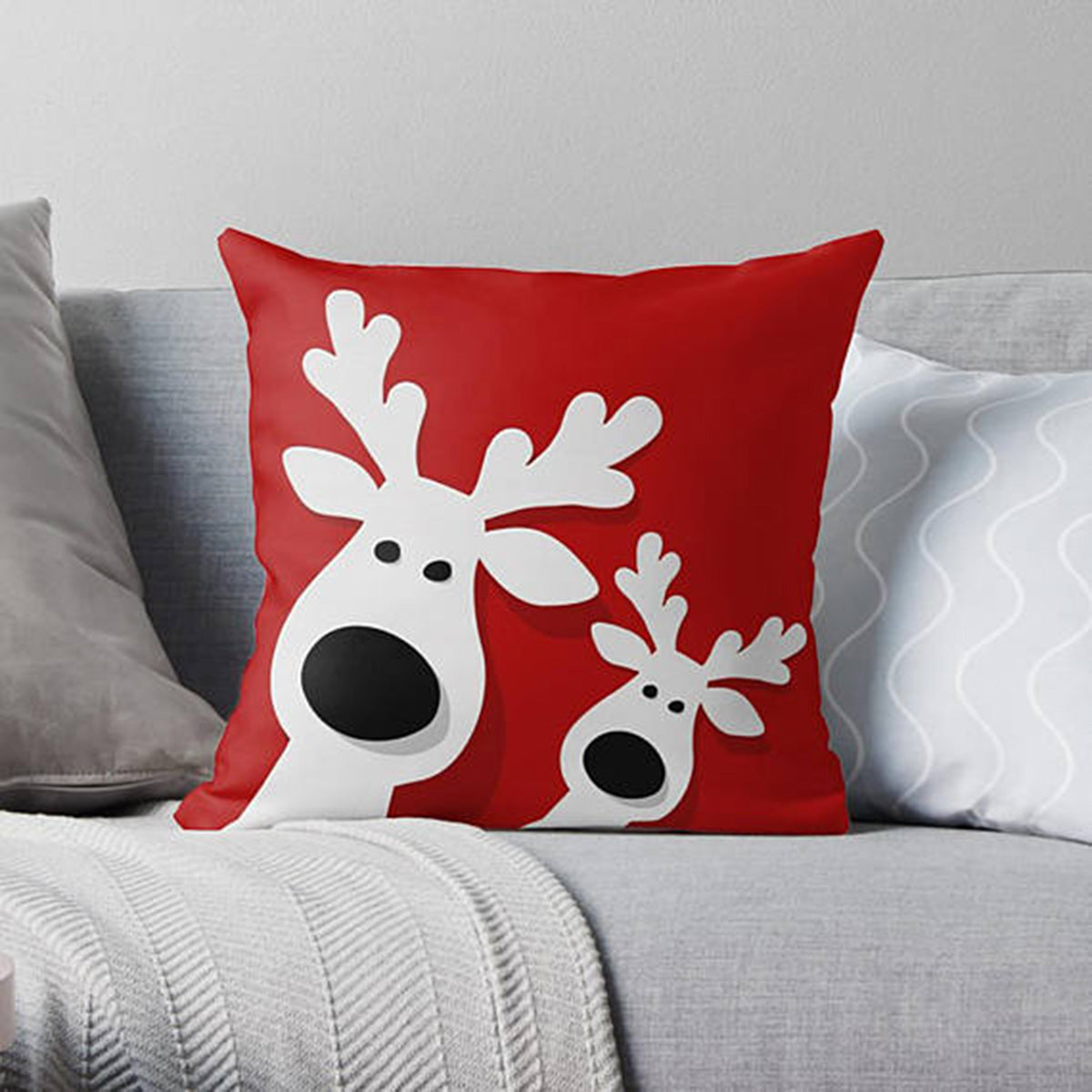 Two reindeer design on white pillow.