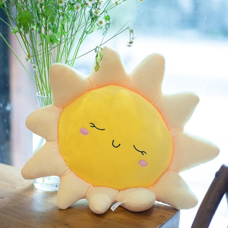 Happy sun pillow resting on chair.