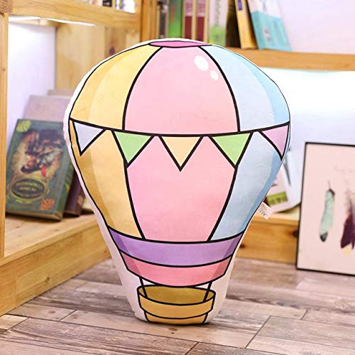 A vibrant hot air balloon pillow resting on a wooden floor, adding a pop of color to the room's decor.