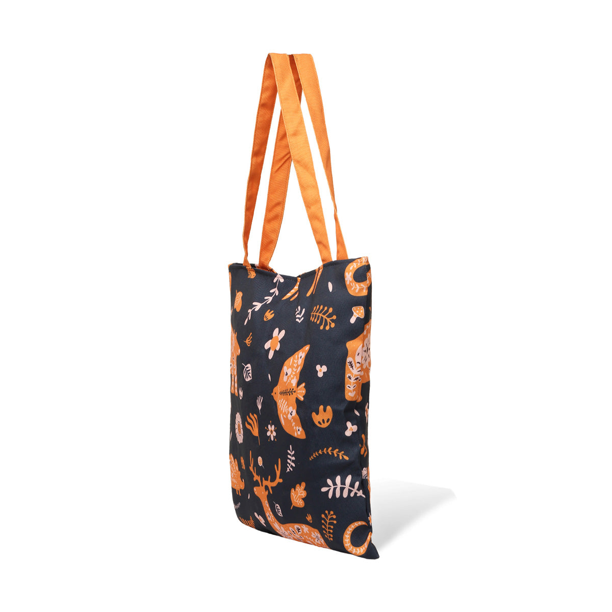 Side view of A black tote bag with orange and white animal and plant print designs, featuring deer, fish, and flowers, with orange handles.