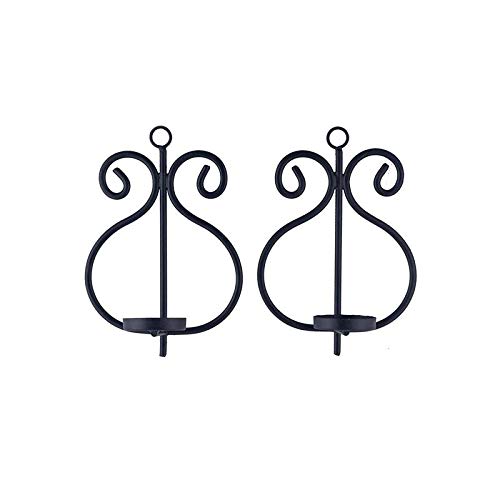 Enhance your ambiance with this sleek black metal candle holder adorned with beautiful red glass.