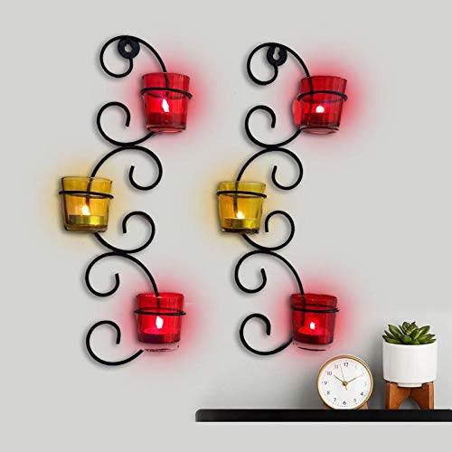Decorative wall sconce holding three candles.