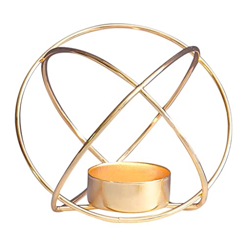 Stylish gold metal tealight holder with purple candle burning.