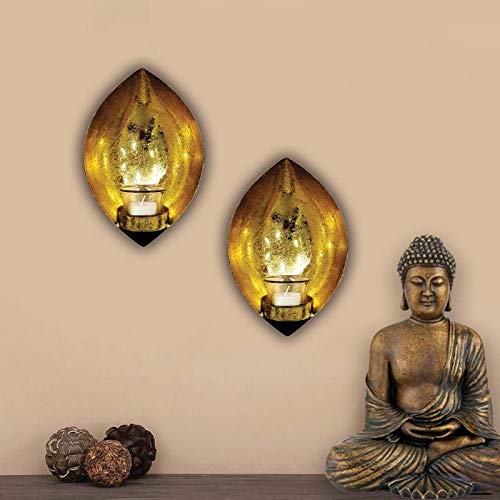 Two elegant gold leaf wall lights with candles, adding a touch of sophistication to any room decor.