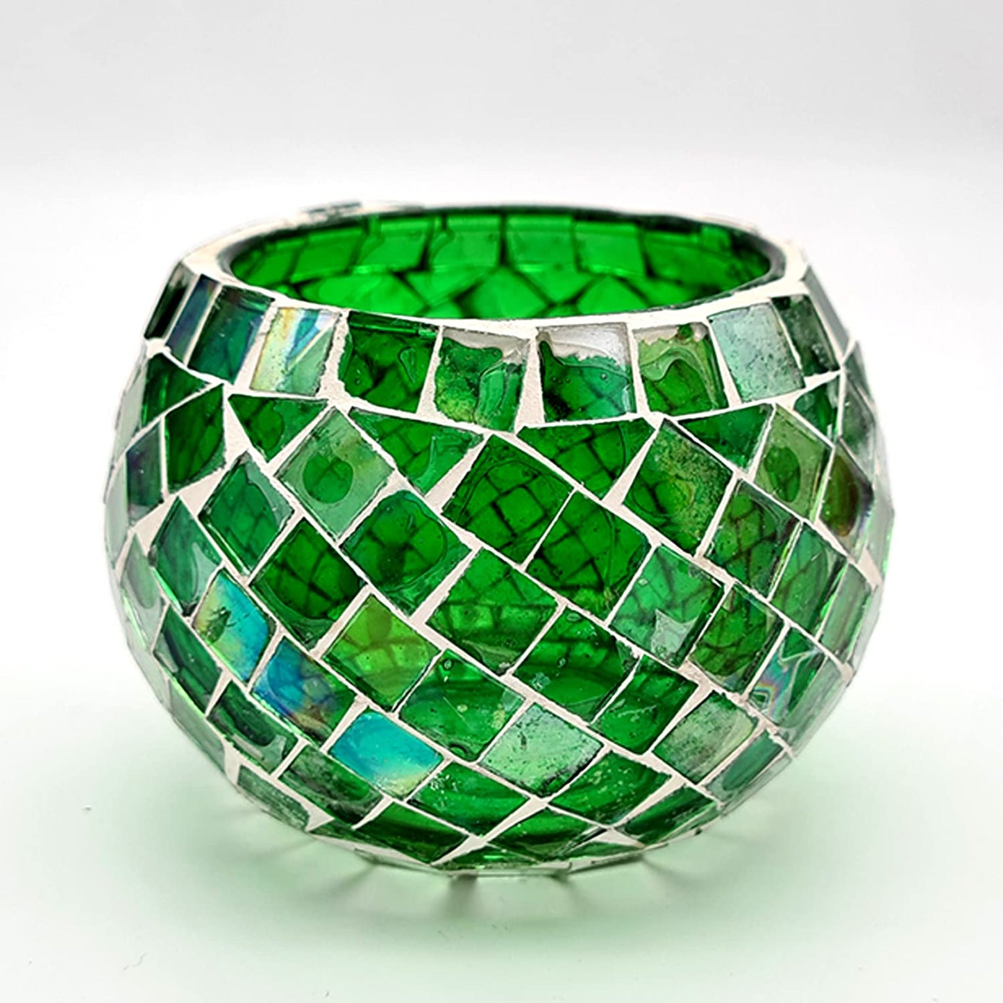 A green glass bowl with intricate mosaic detailing, a chic addition to your home decor or dining table.