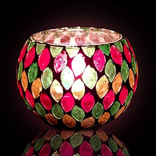 Colorful glass candle holder with a radiant light source.