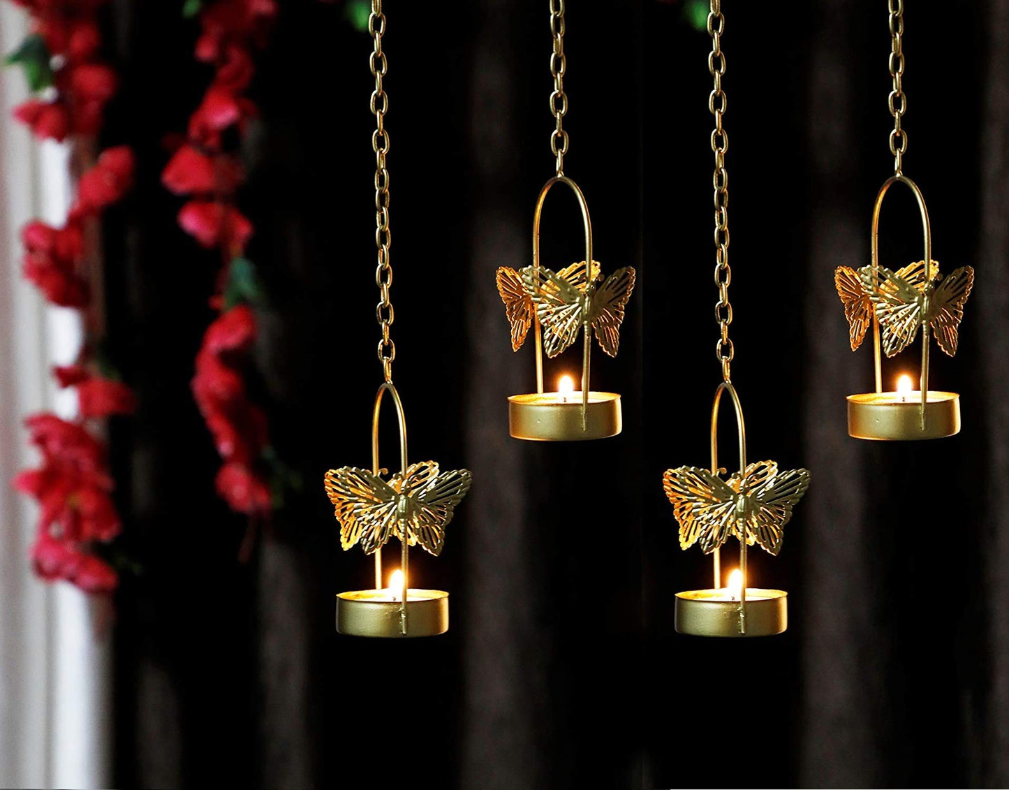 Two tealights with butterfly designs hanging in the air, casting a warm and inviting glow.