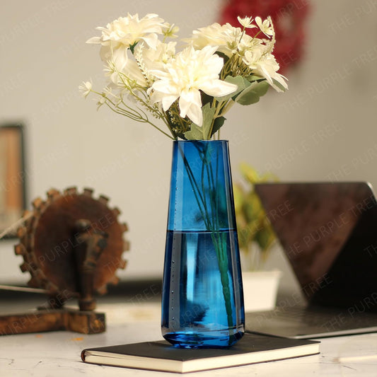 A vase brimming with a variety of blooming flowers, creating a charming and inviting atmosphere.