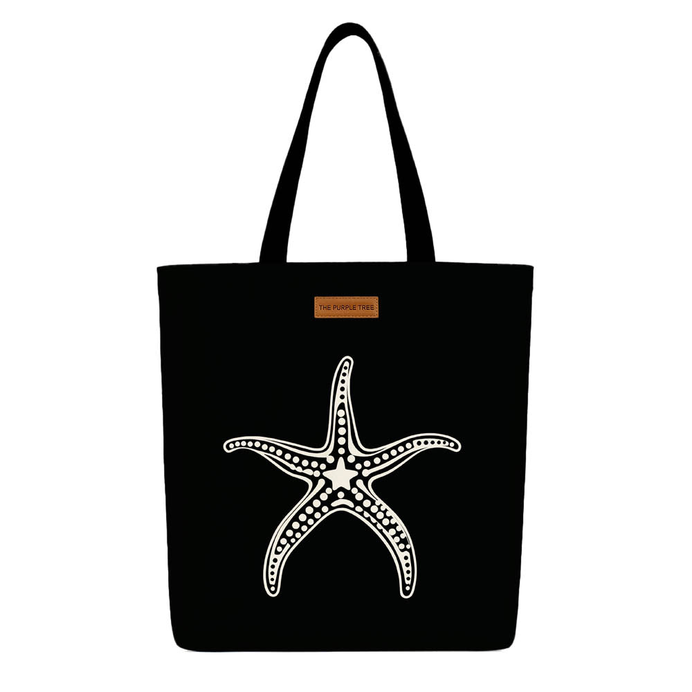 A black tote bag featuring a starfish design, ideal for beach outings or casual use.