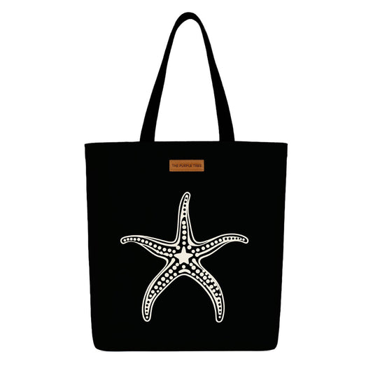A black tote bag featuring a starfish design, ideal for beach outings or casual use.