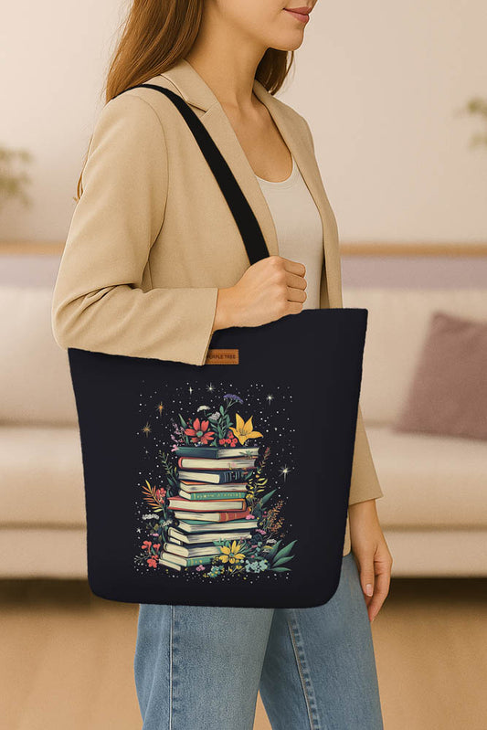 A stylish tote bag containing several books and vibrant flowers, symbolizing a love for reading and nature.