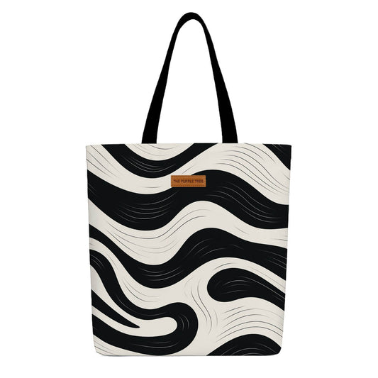 Black and white zebra print tote bag with sturdy handles, ideal for shopping or casual outings.