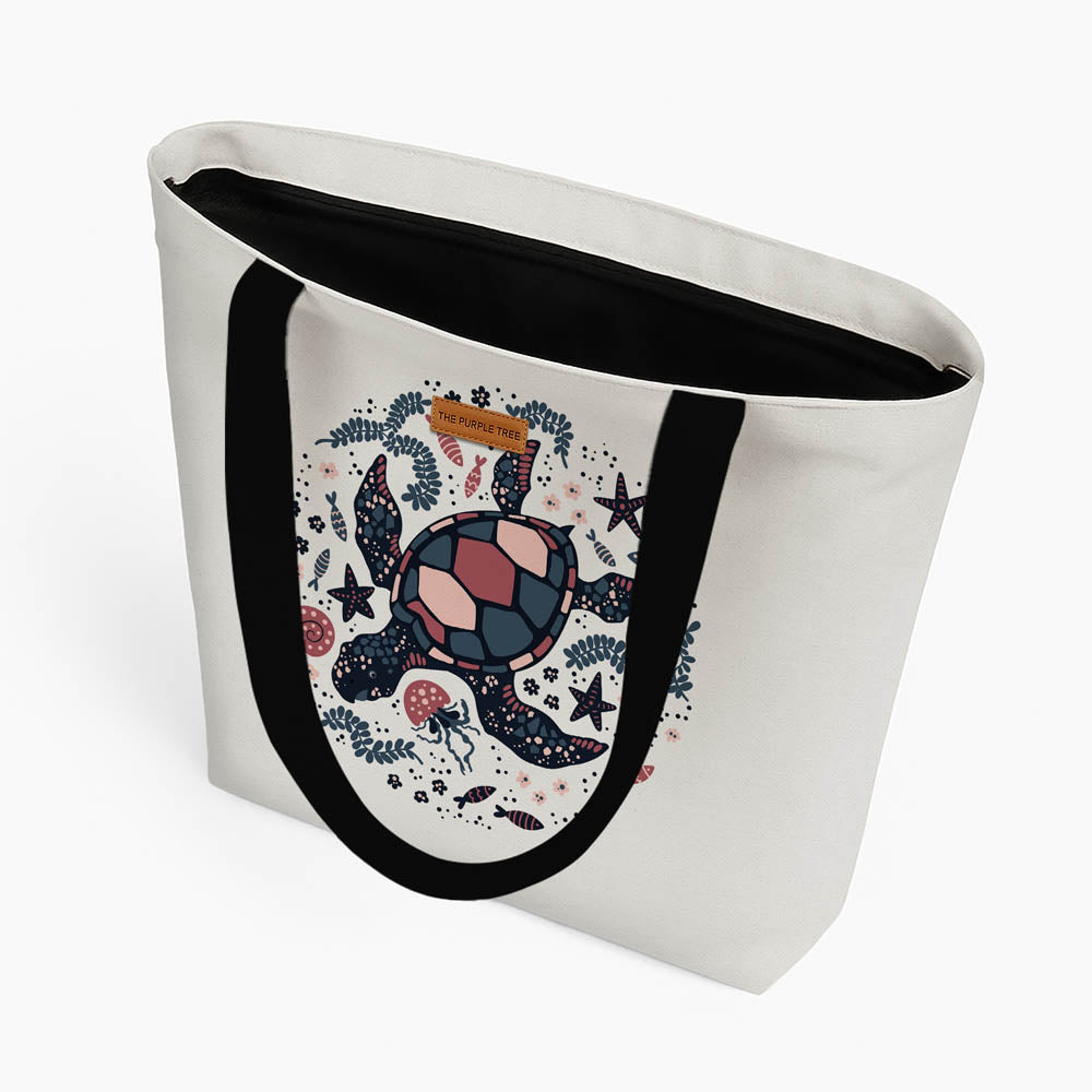A tote bag showcasing a whimsical turtle illustration in bright colors.