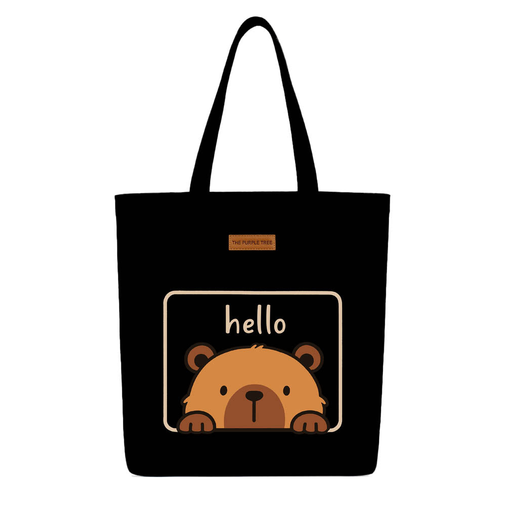 A tote bag featuring a friendly bear design with the text "hello" prominently displayed.