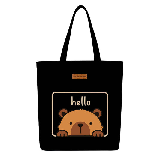 A tote bag featuring a friendly bear design with the text "hello" prominently displayed.