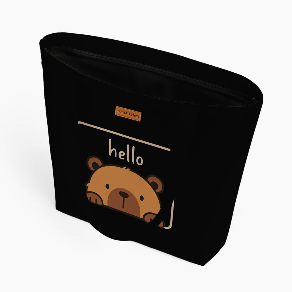 A tote bag showcasing a cute bear illustration alongside the phrase "hello" in a fun, eye-catching font.